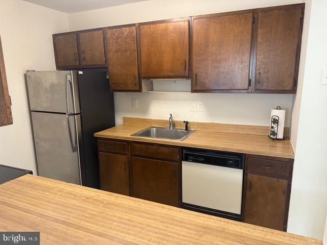 a room with a sink and cabinets