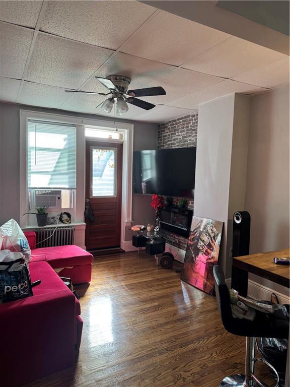 3112 Quentin Road Brooklyn, NY 11234 - Photo 4 of 6 a living room with furniture and a flat screen tv