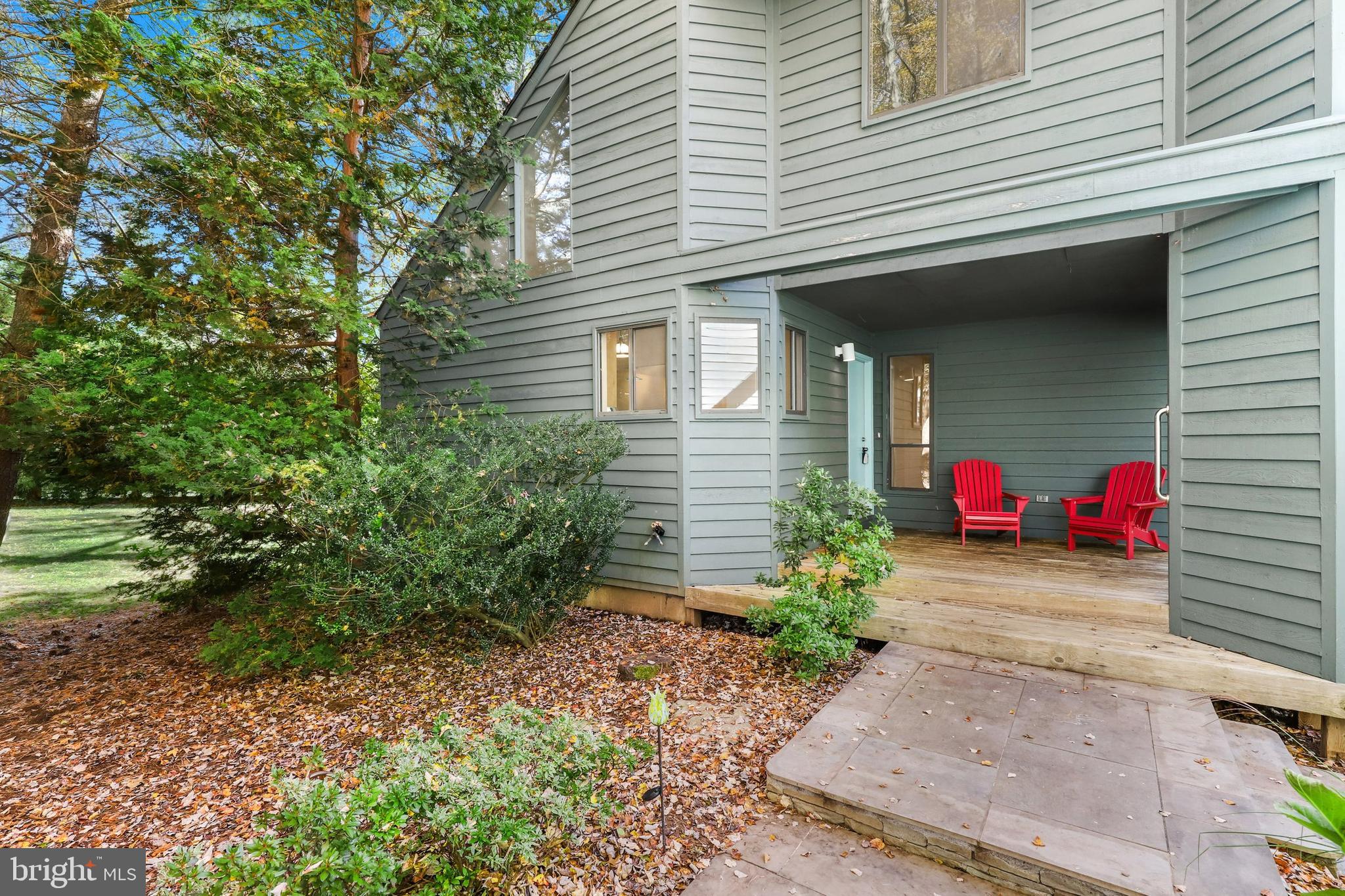 11917 Moss Point Lane Reston, VA 20194 - Photo 4 of 79 a front view of a house with a yard and garage