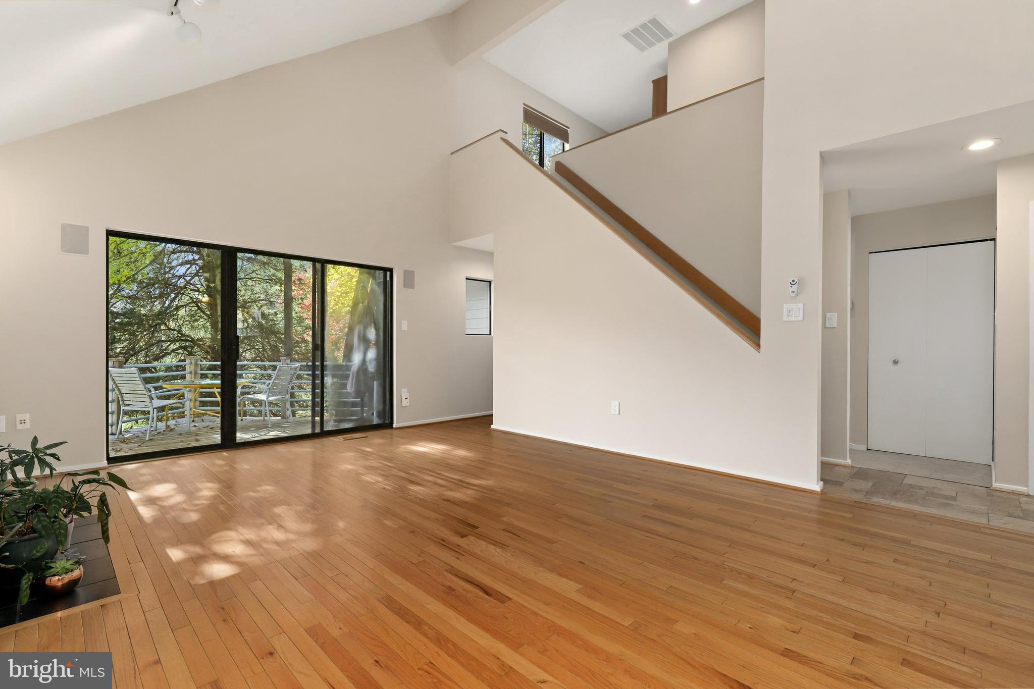 11917 Moss Point Lane Reston, VA 20194 - Photo 8 of 79 a view of an empty room with wooden floor and a window