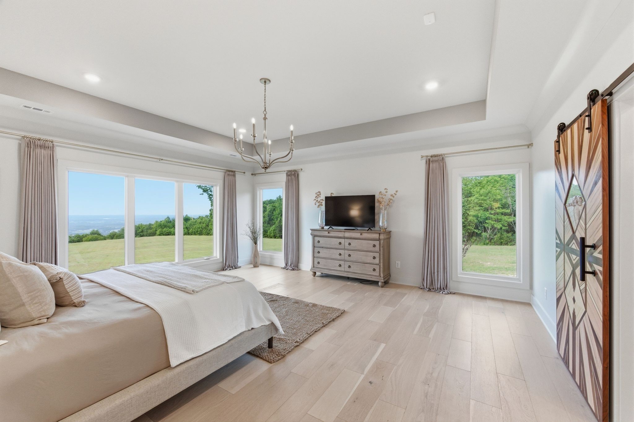 577 Box House Road Belvidere, TN 37306 - Photo 29 of 77 a bed room with a bed a television and a large window