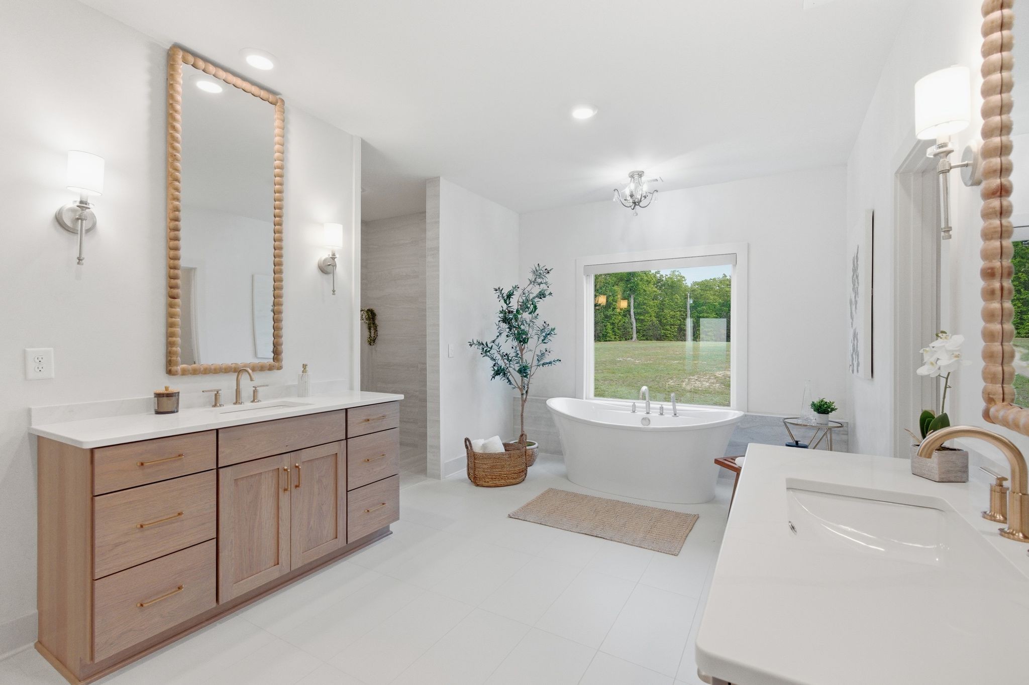 577 Box House Road Belvidere, TN 37306 - Photo 32 of 77 a spacious bathroom with a double vanity sink a large mirror a bathtub and window