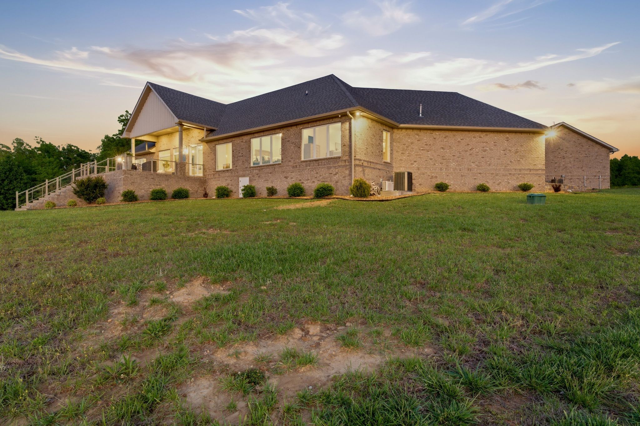 577 Box House Road Belvidere, TN 37306 - Photo 6 of 77 a view of a big house with a big yard and large trees