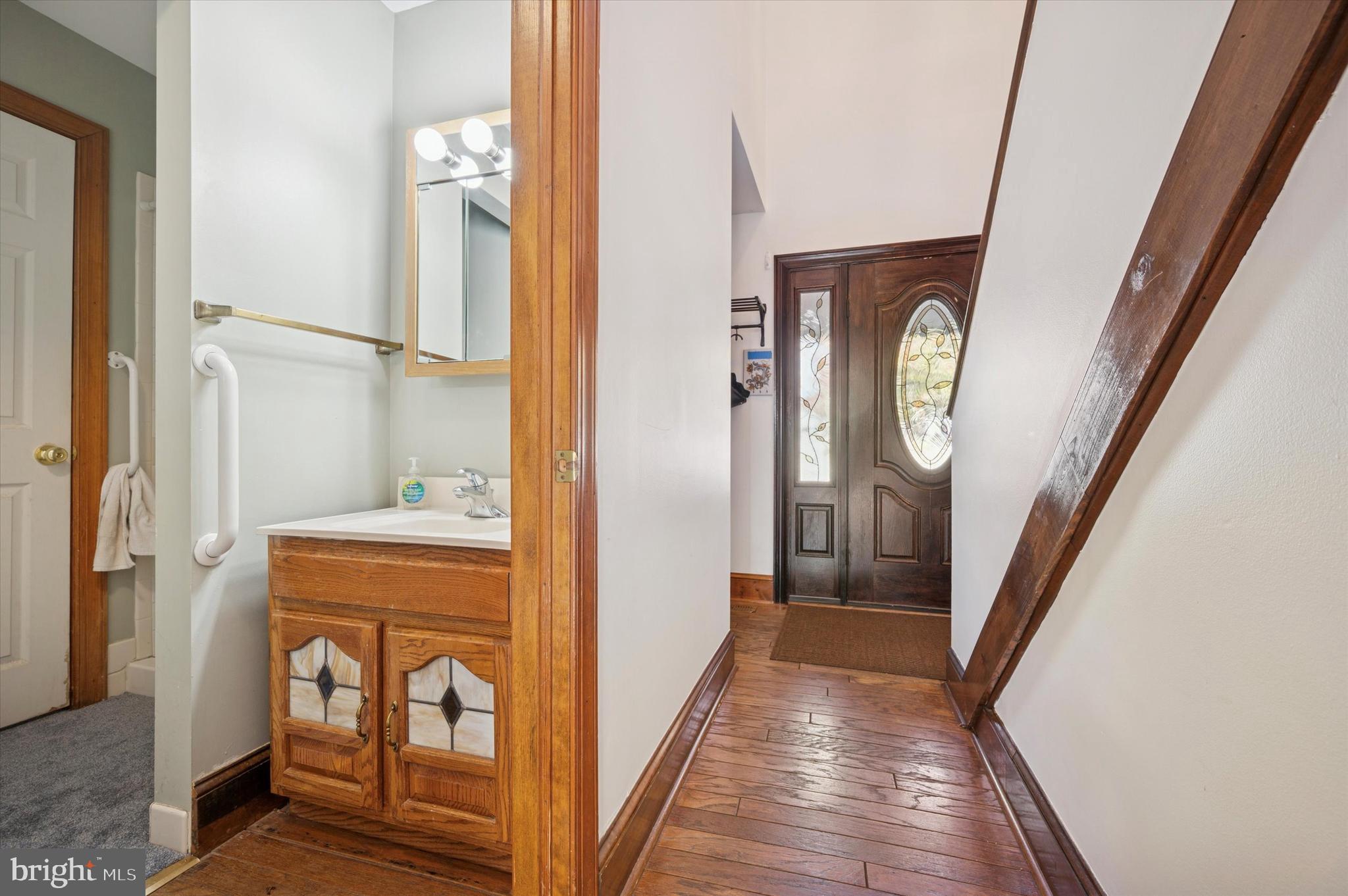 205 Delmar Street Philadelphia, PA 19128 - Photo 6 of 25 a view of a hallway with wooden floor and entryway