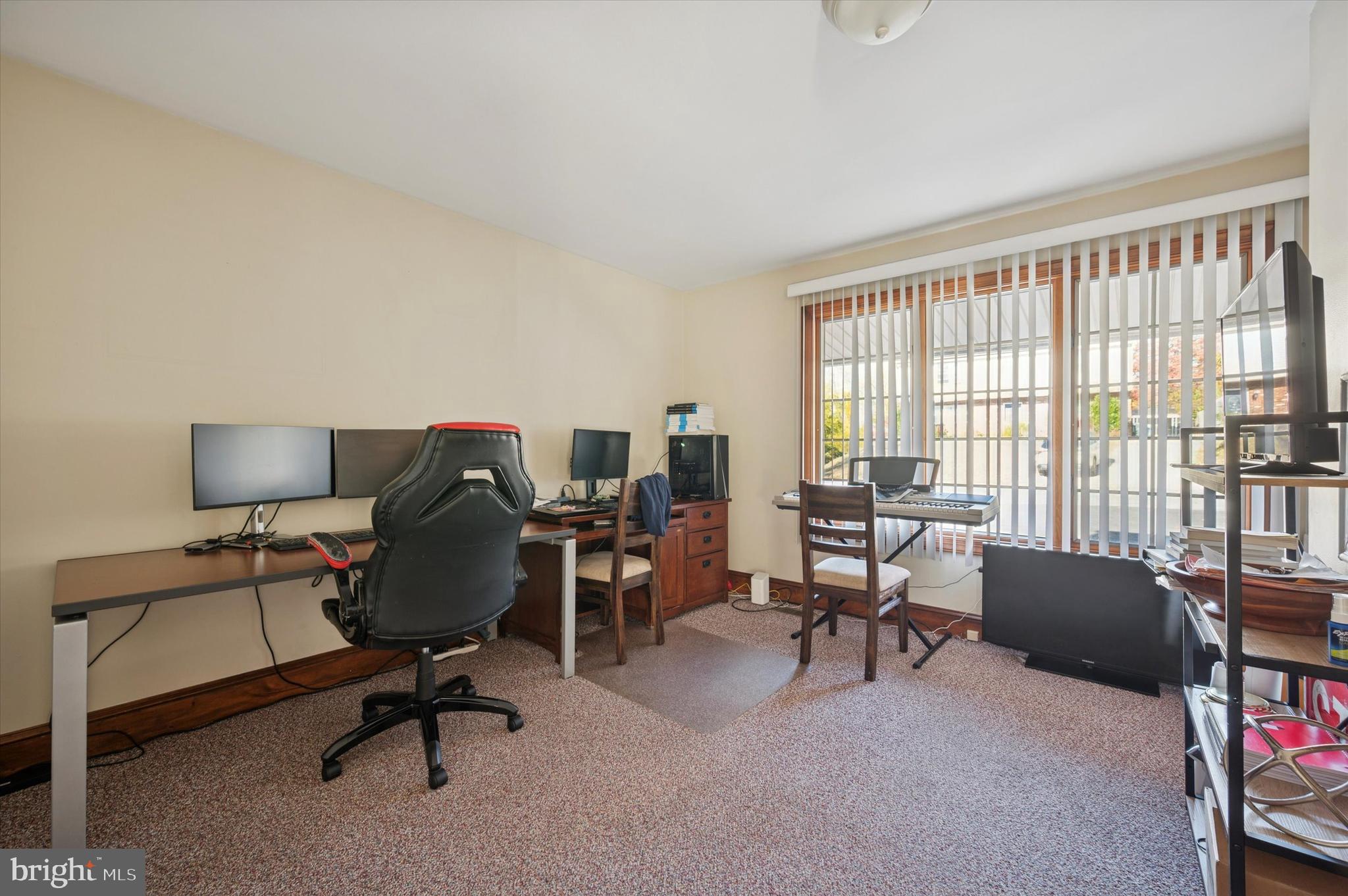 205 Delmar Street Philadelphia, PA 19128 - Photo 7 of 25 a view of a livingroom with workspace and a window