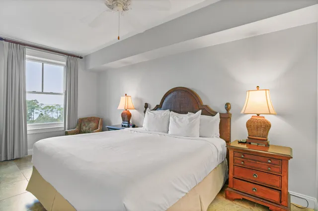 a bedroom with bed and a window