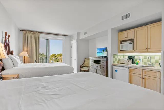 a bedroom with a bed and a cabinets