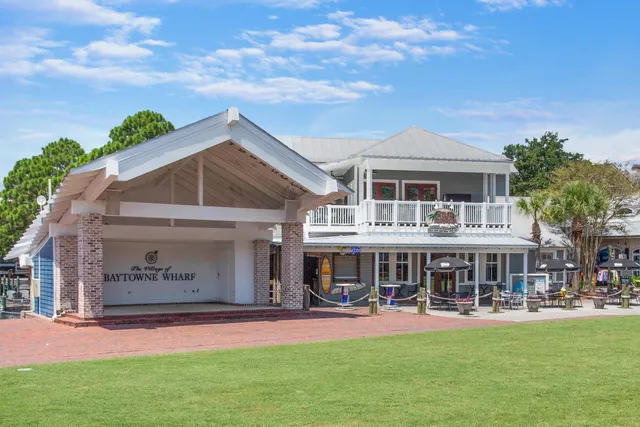 a front view of a house with swimming pool having outdoor seating