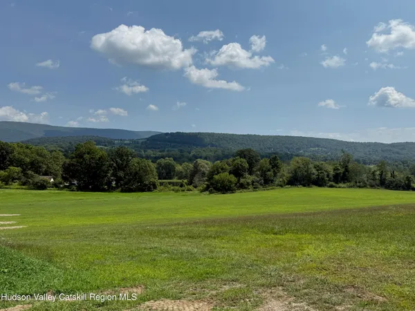 a view of a golf course with a big yard