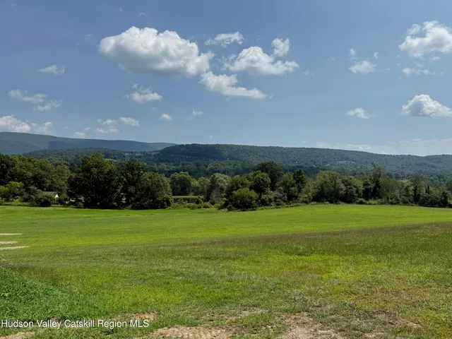 a view of a golf course with a big yard