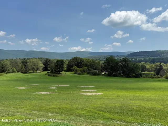 a view of a golf course with a big yard