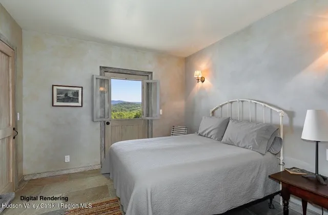 a bedroom with a bed and a lamp on table