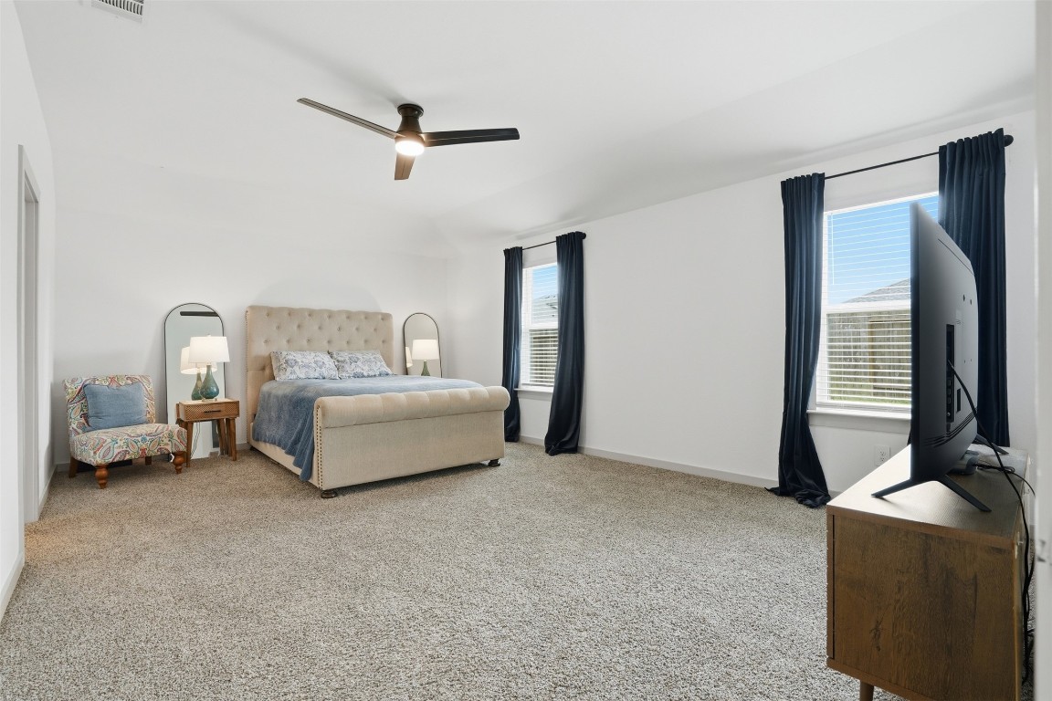 1022 Curly Angora Court Rosharon, TX 77583 - Photo 14 of 17 a bedroom with a bed and a couch