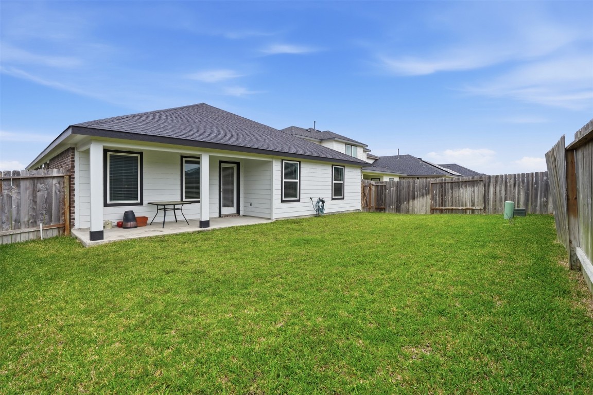 1022 Curly Angora Court Rosharon, TX 77583 - Photo 16 of 17 a front view of house with yard and green space