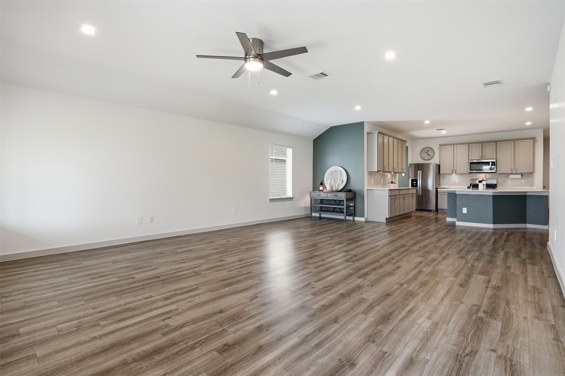 1022 Curly Angora Court Rosharon, TX 77583 - Photo 6 of 17 a view of kitchen and livingroom with furniture wooden floor