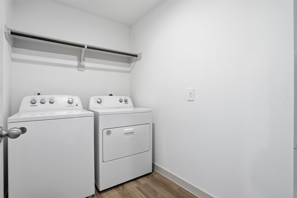 1022 Curly Angora Court Rosharon, TX 77583 - Photo 9 of 17 a utility room with dryer and washer