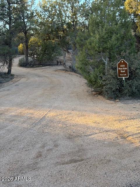 0 West Slate Road, Unit 98 Prescott, AZ 86305 - Photo 5 of 9 a view of a field with trees in the background
