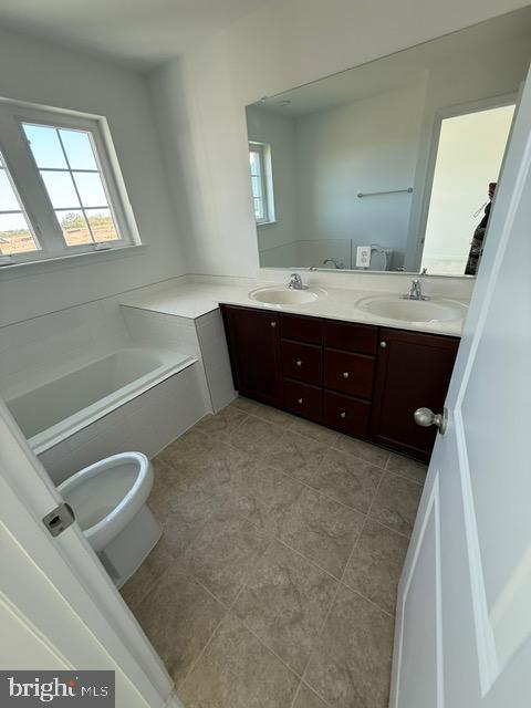 72 Bitsy Bunker Hill, WV 25413 - Photo 3 of 13 a bathroom with a tub sink vanity and mirror