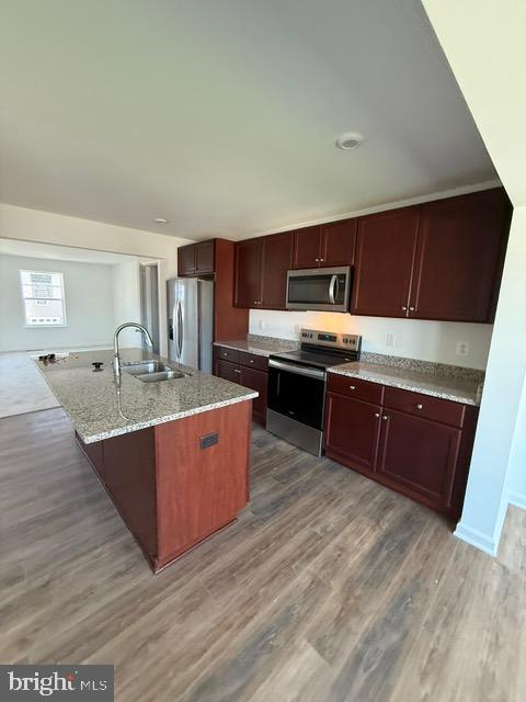 72 Bitsy Bunker Hill, WV 25413 - Photo 5 of 13 a large kitchen with stainless steel appliances granite countertop a stove a sink dishwasher and a refrigerator