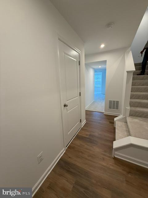 72 Bitsy Bunker Hill, WV 25413 - Photo 6 of 13 a view of a hallway with wooden floor and staircase