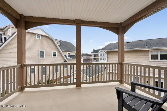 a view of a living room and chandelier fan