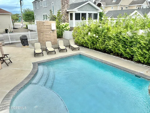 a view of a patio with a table and chairs