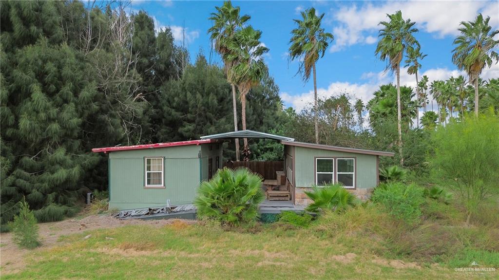 27246 McLelland Road Harlingen, TX 78552 - Photo 9 of 10 a front view of a house with a garden