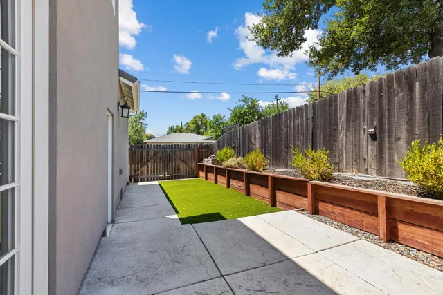 a view of a chairs and tables in the backyard