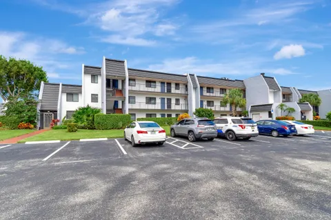 a view of a cars parked in front of a house