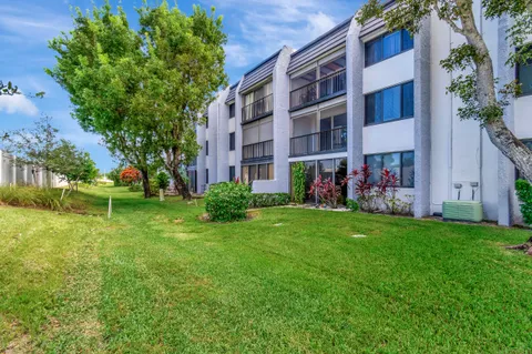 a view of building with yard
