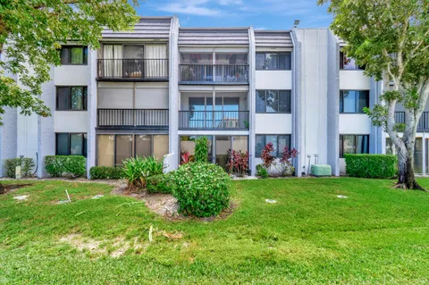 a view of an apartment with a garden and plants