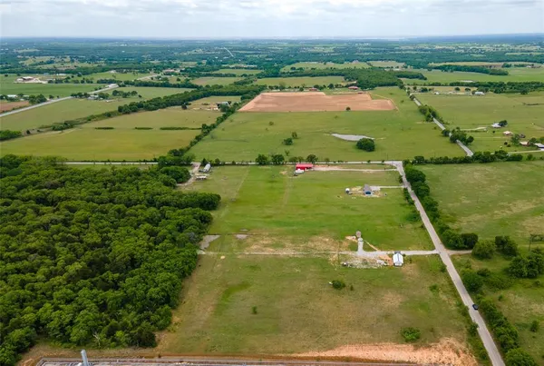 a view of a lake with a yard