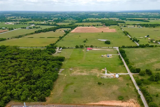 a view of a lake with a yard