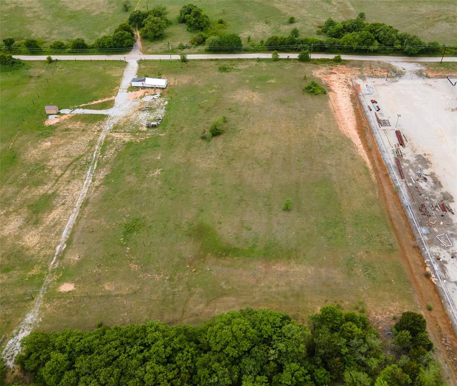 Tbd Tbd Cr-1792 Sunset, TX 76270 - Photo 18 of 23 a view of a lake with a yard and trees