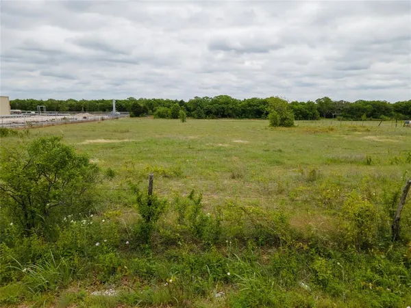 a view of a lake with houses in the background