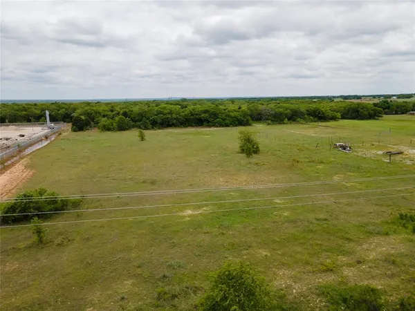 a view of a lake with houses in the background