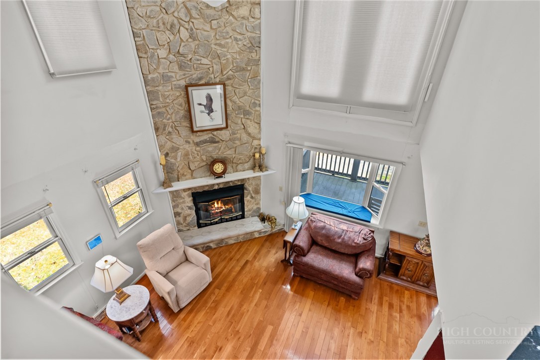 271 Quail Hollow Road Crumpler, NC 28617 - Photo 15 of 30 a living room with furniture and a fireplace
