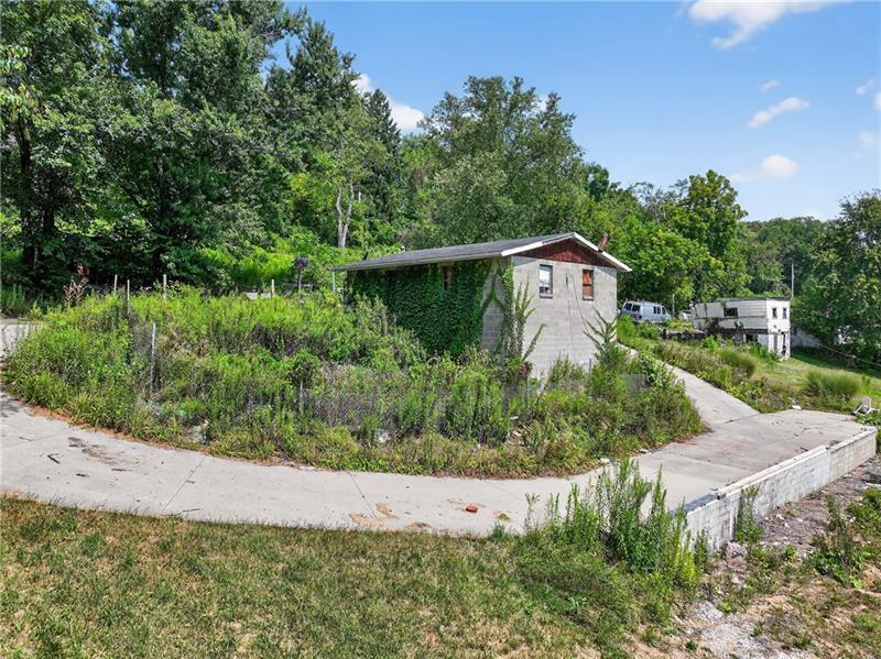 3143 Santiago Road Imperial, PA 15126 - Photo 4 of 16 a view of a garden with plants and large trees