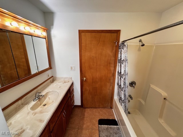 6949 Fee Road Rome, OH 44085 - Photo 15 of 19 Bathroom featuring vanity, shower / tub combo, and tile patterned floors