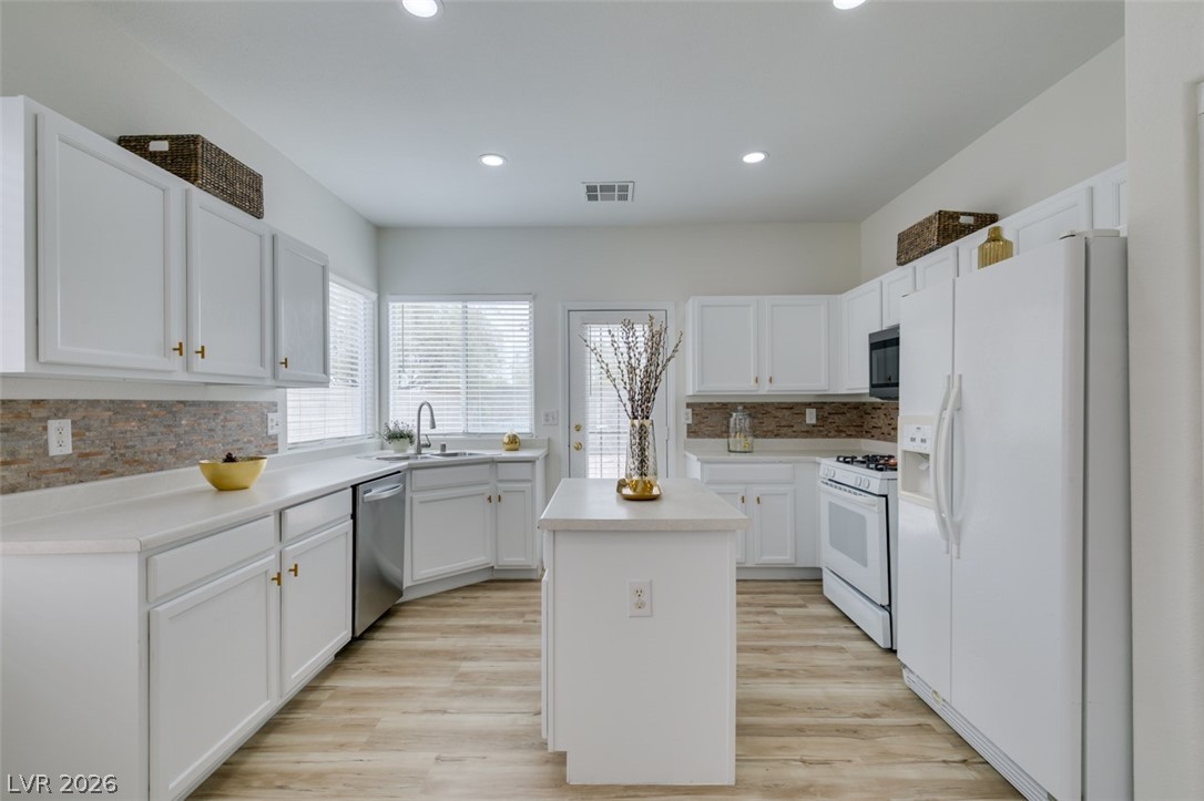 10959 Pumpkin Ridge Avenue Las Vegas, NV 89135 - Photo 15 of 51 A well-appointed kitchen features a central island, ample cabinetry to take care of all the demands of your family.