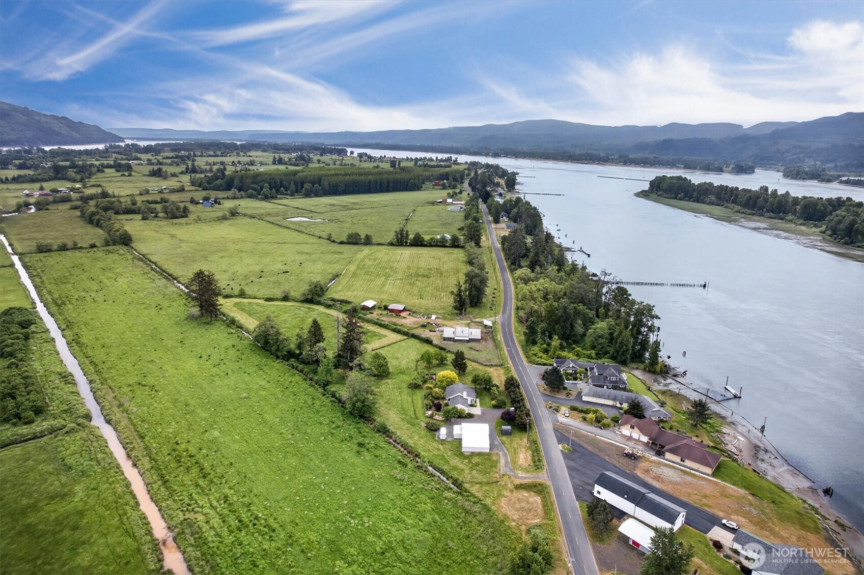 218 West Sunny Sands Road Cathlamet, WA 98612 - Photo 3 of 40 a view of a city with mountains in the background