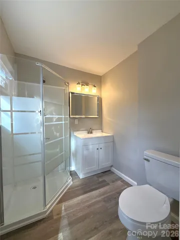 a bathroom with a mirror and a shower
