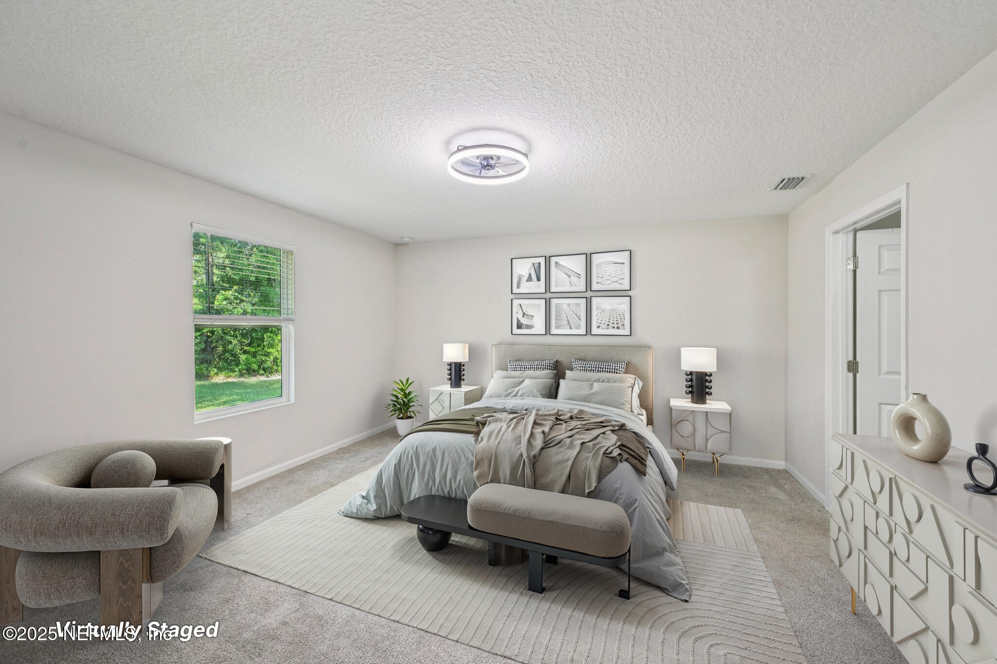 2400 Lundy Road Palatka, FL 32177 - Photo 13 of 34 a bedroom with furniture and a large window