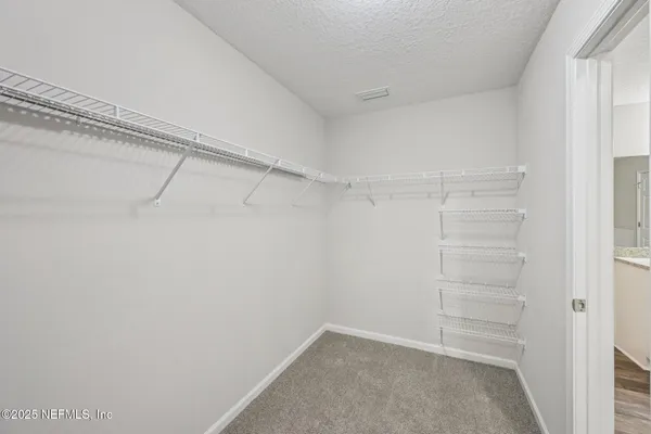 a view of an empty walk in closet