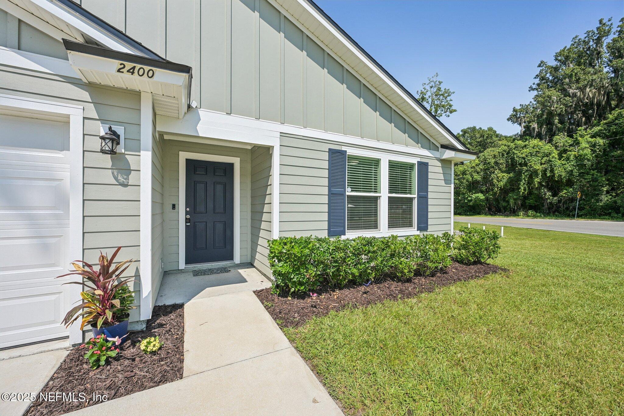 2400 Lundy Road Palatka, FL 32177 - Photo 2 of 34 a front view of a house with garden