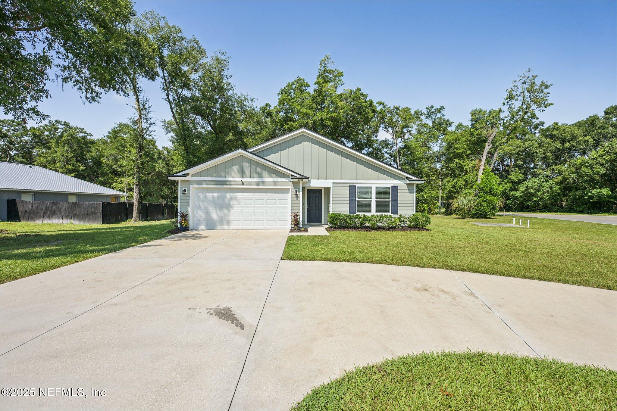 2400 Lundy Road Palatka, FL 32177 - Photo 32 of 34 a view of house with a yard and potted plants