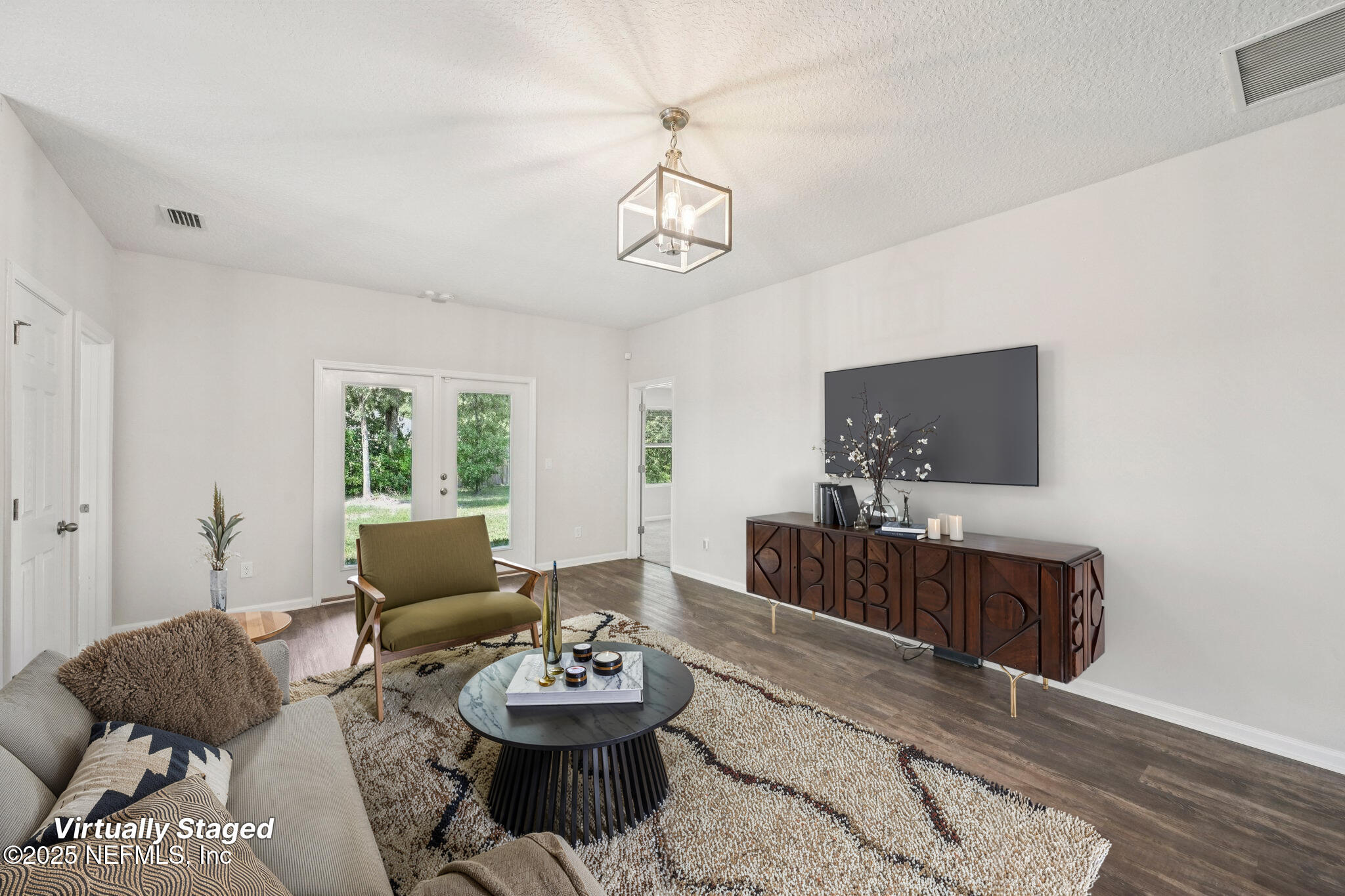 2400 Lundy Road Palatka, FL 32177 - Photo 7 of 34 a living room with furniture and a flat screen tv