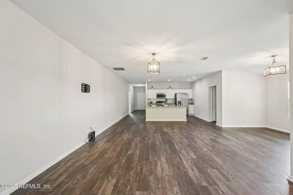 a view of a livingroom with wooden floor
