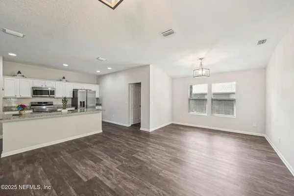 a view of kitchen with wooden floor