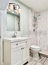 512 Wideview Avenue Tarpon Springs, FL 34689 - Photo 24 of 30 a bathroom with a sink toilet and shower